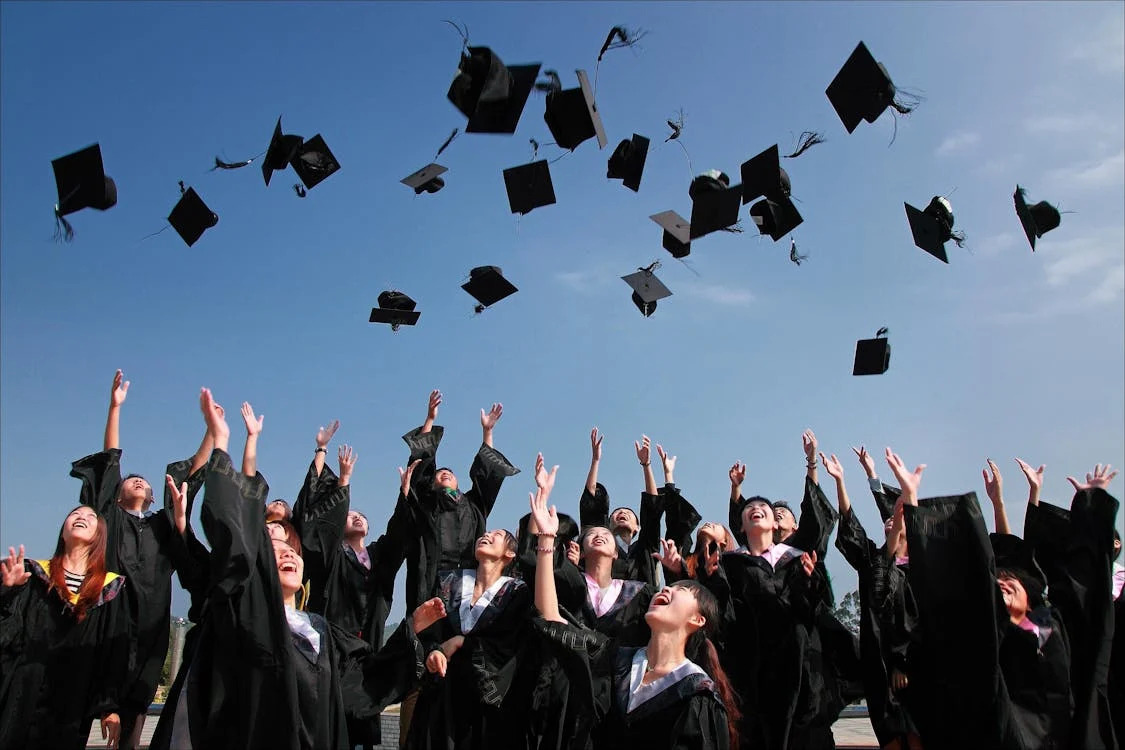 Happy graduates on campus